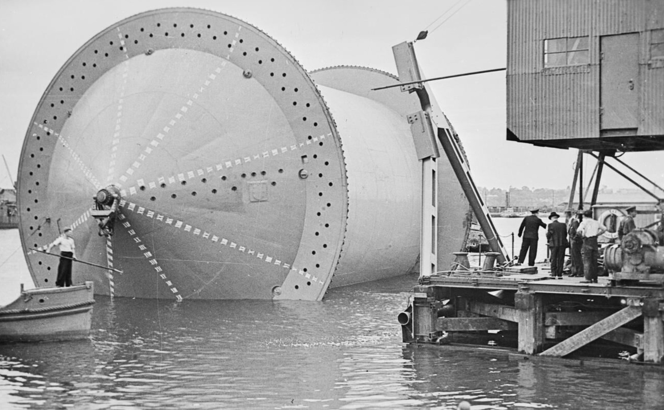 Laying the pipeline: a Conundrum being moved into position into a specially constructed dock in preparation for the winding on of the pipe. 